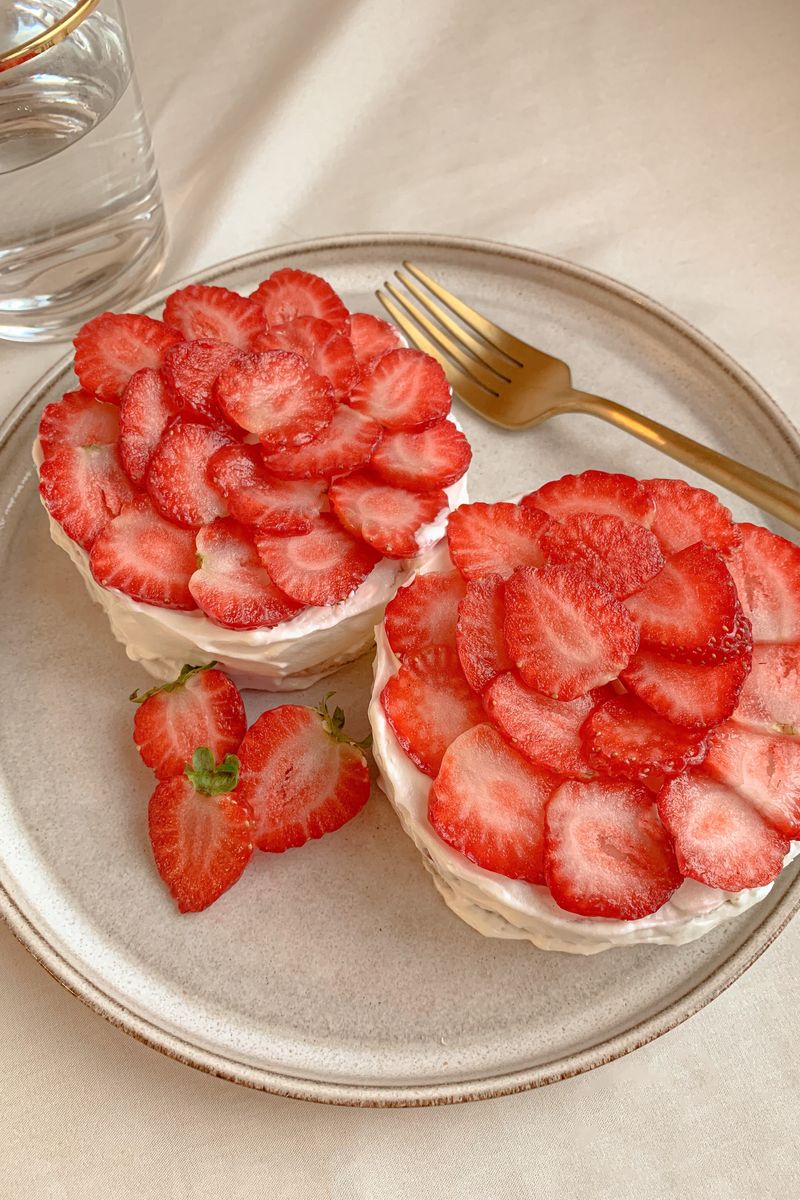 Layered cakes topped with fresh strawberries